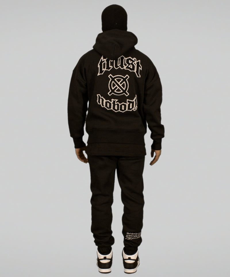 'TRUST Nobody' Dark Hoodie - TRUST Amsterdam